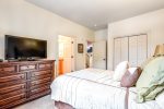 Guest bedroom on the main level offers a queen bed